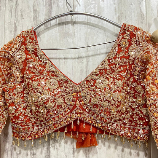 Pleasing orange colour crop top Lehenga