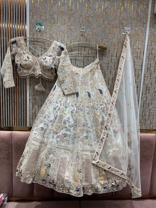 Lavishing white peacock crop top Lehenga