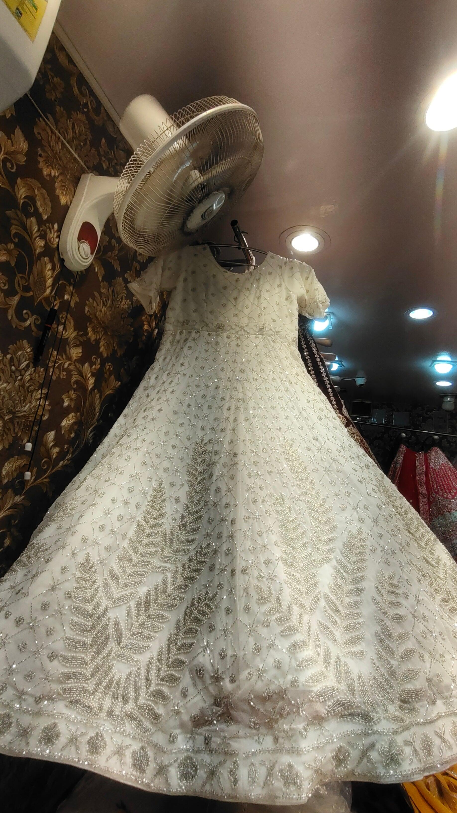 white peplum dress pakistani This off white dress has a peplum top with antique handwork done in three layers with a banarasi skirt - Nikita Bhushan