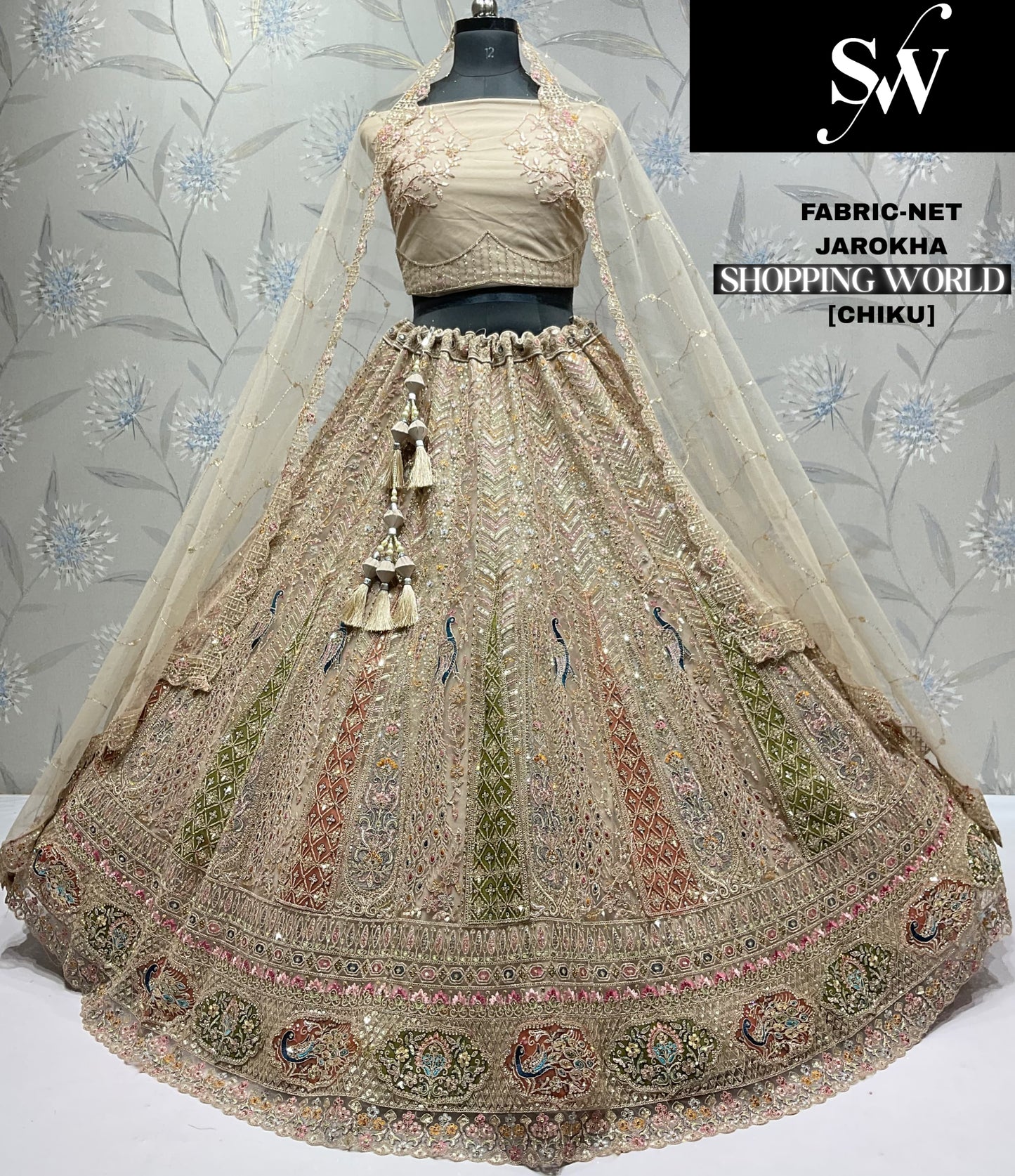Good looking white peacock net Lehenga