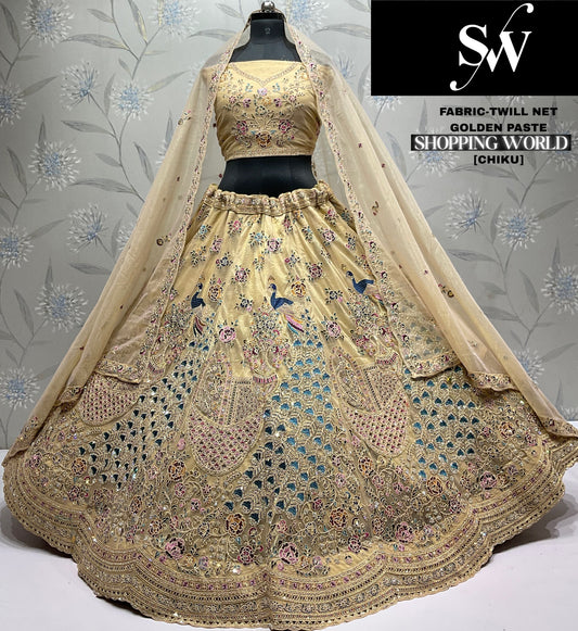 Attractive Chiku Golden peacock Twill Net Lehenga