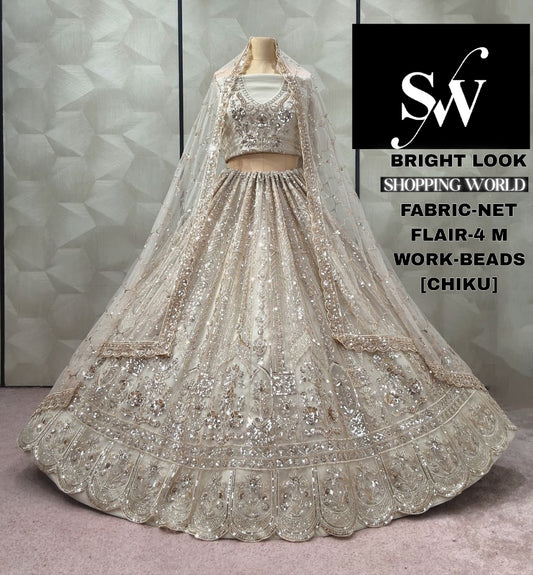 Delightful Chiku golden Net  Lehenga