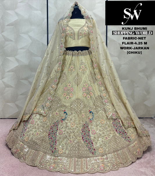 Pretty Chiku golden peacock Net Lehenga