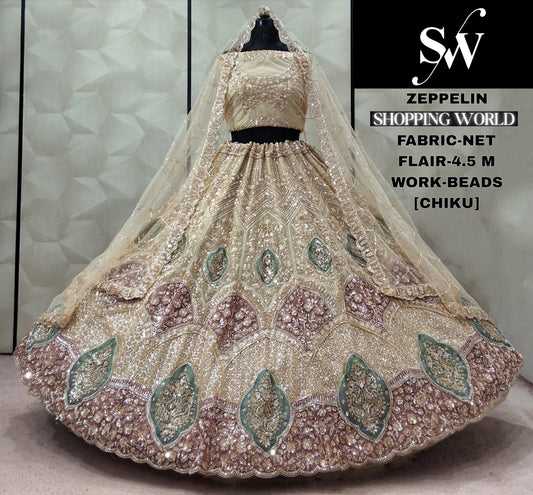 Chiku Golden Peacock Net Lehenga