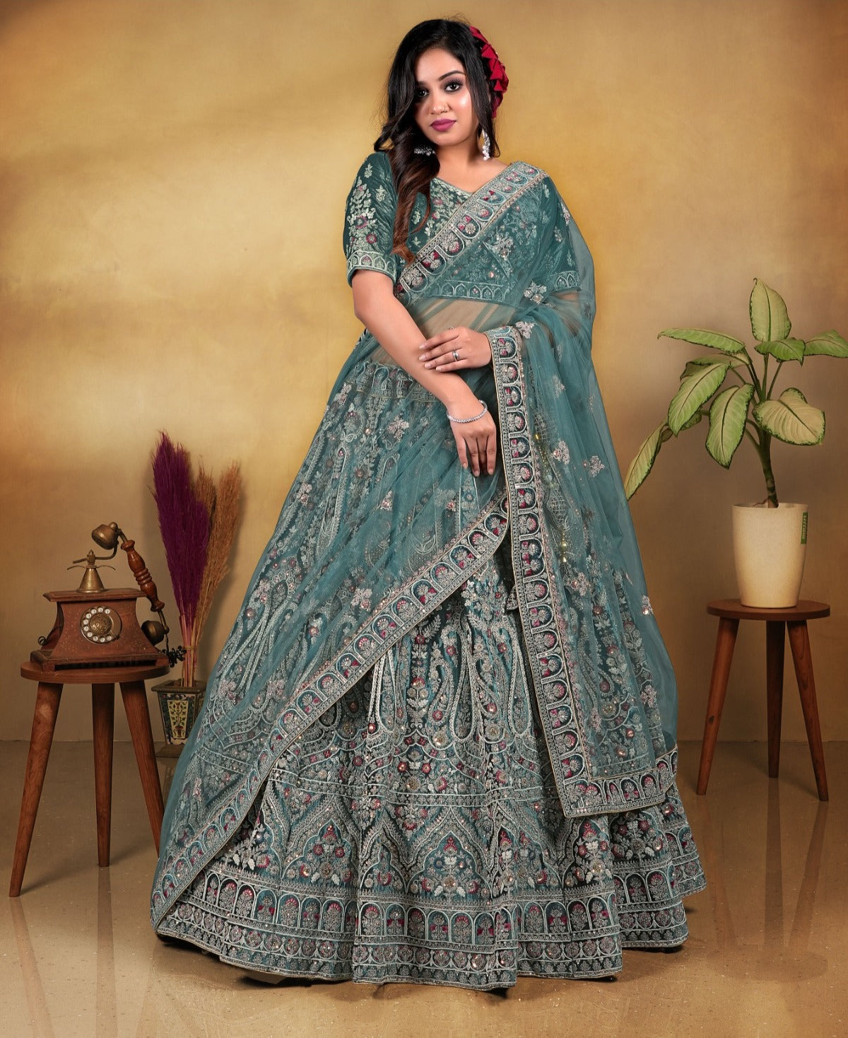 Tremendous rama green bridal lehenga net fabric