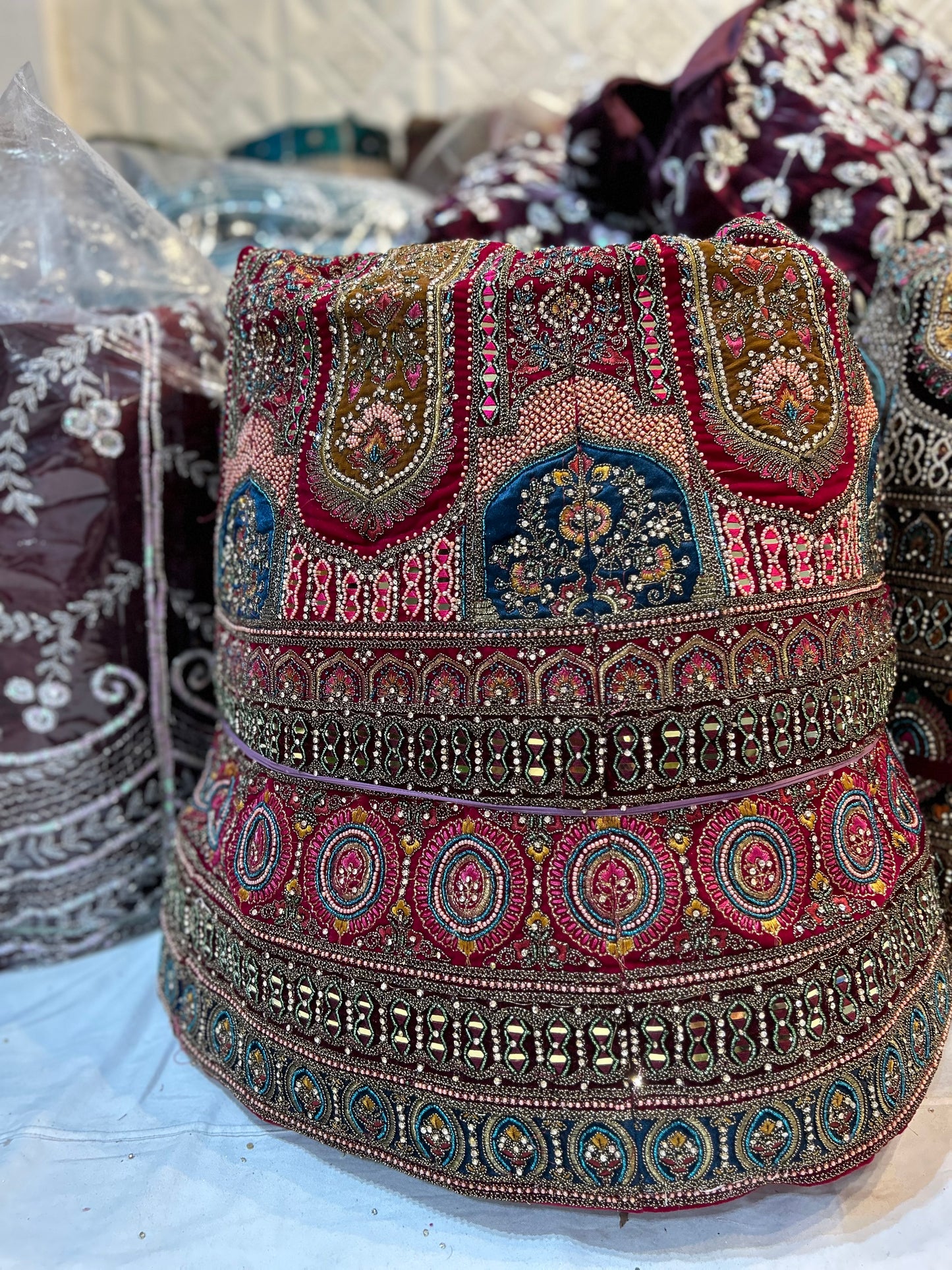 स्टाइलिश ब्राइडल मैरून गोल्डन मोर लहंगा