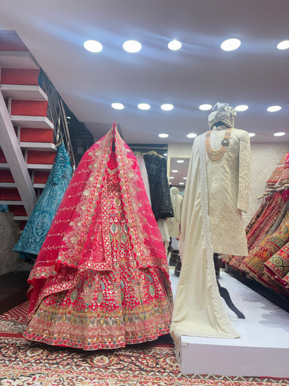 Pretty bridal peacock Lehenga sherwani combo