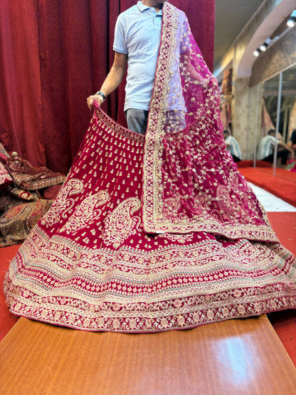 Tremendous dark rani pink peacock bridal Lehenga