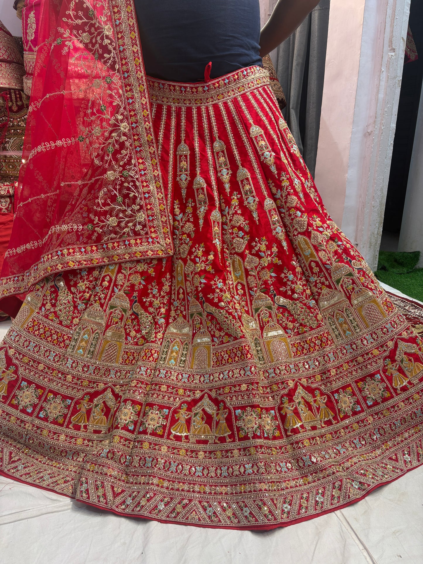 Tremendous red peacock bridal Lehenga