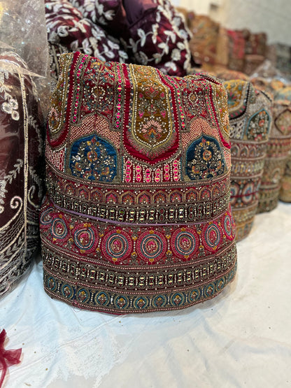 स्टाइलिश ब्राइडल मैरून गोल्डन मोर लहंगा