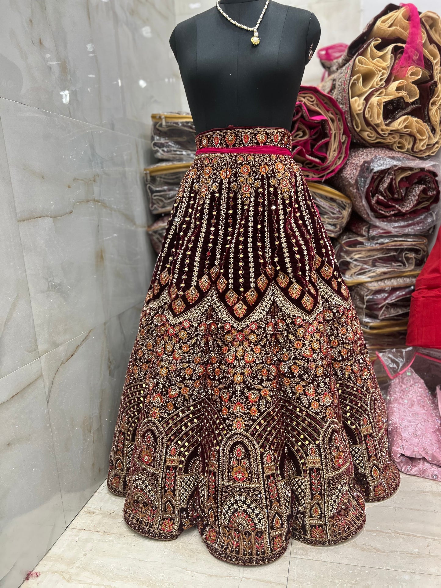 Lovely maroon jhumka ball bridal lehenga