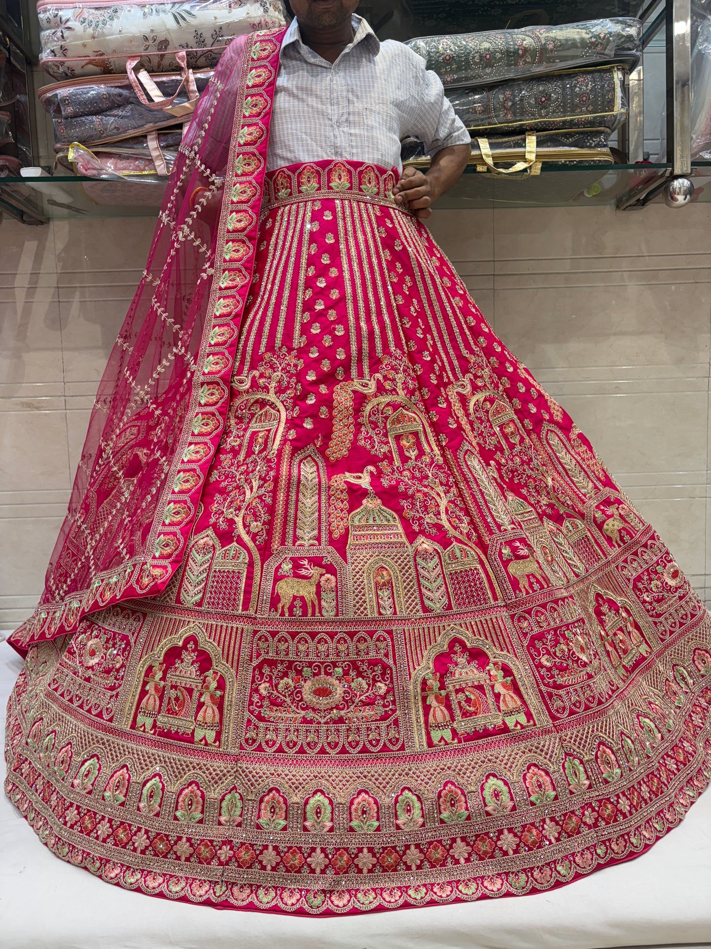 Eye catching Rani pink peacock bridal Lehenga