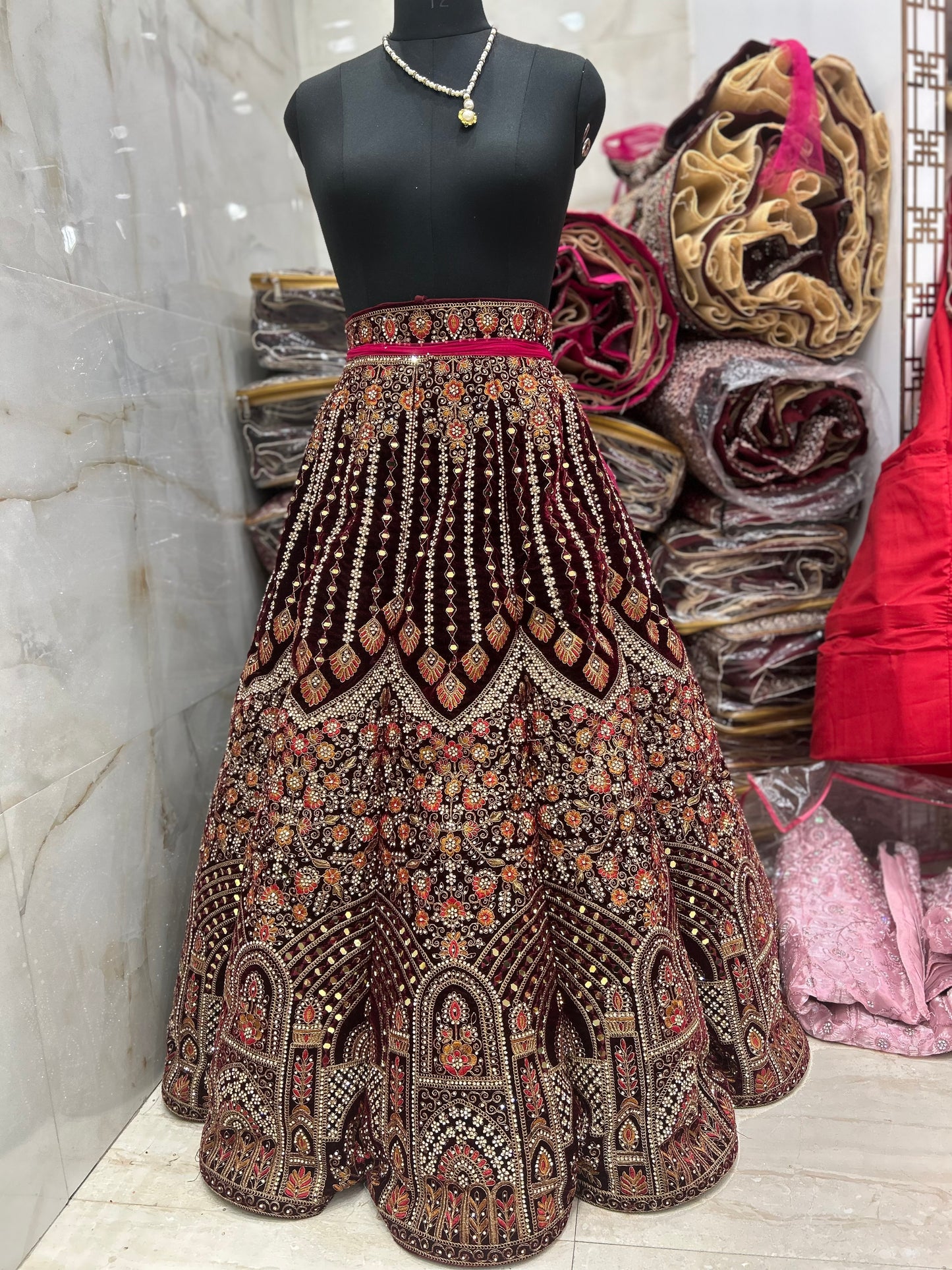 Lovely maroon jhumka ball bridal lehenga