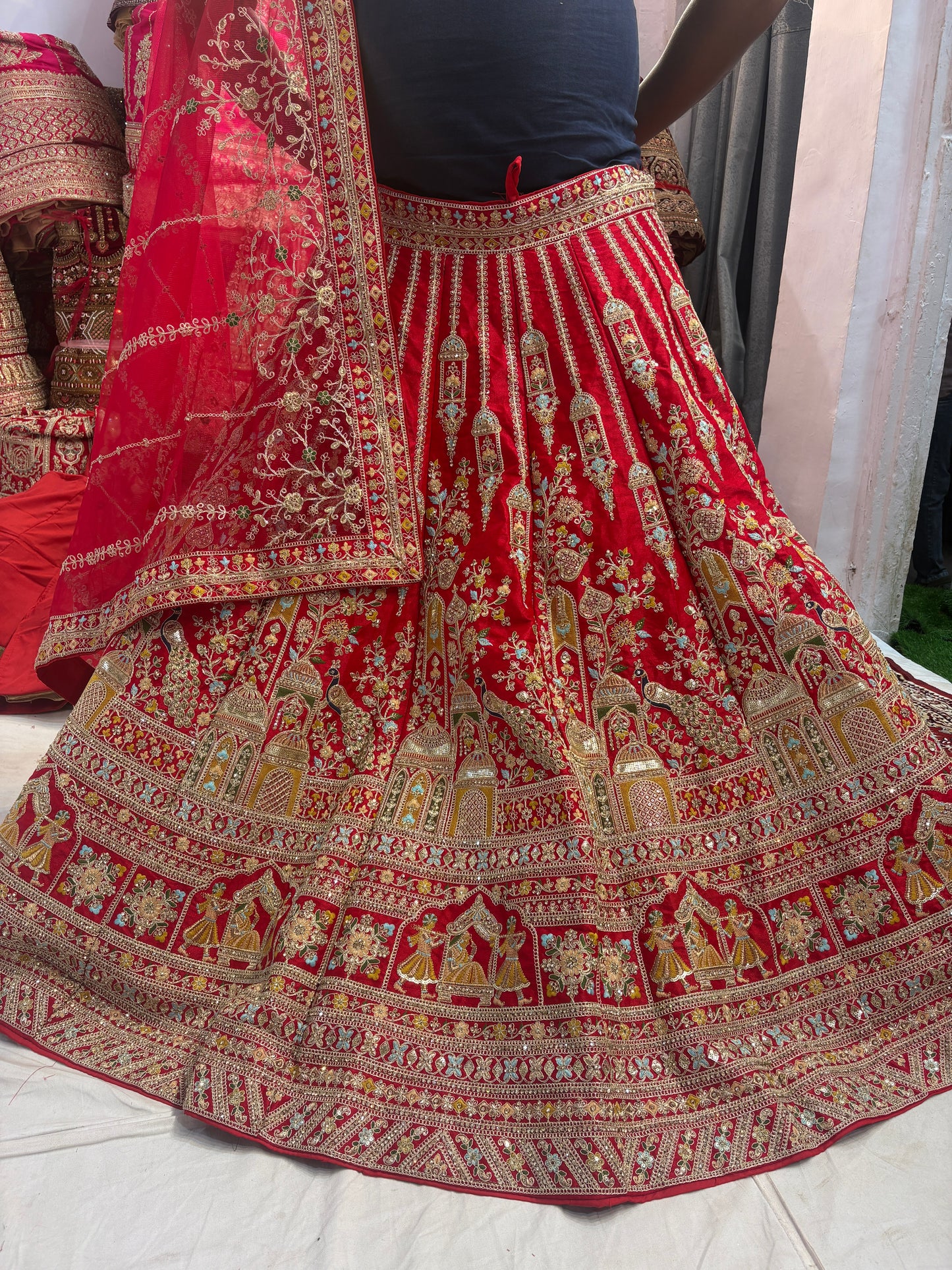Tremendous red peacock bridal Lehenga