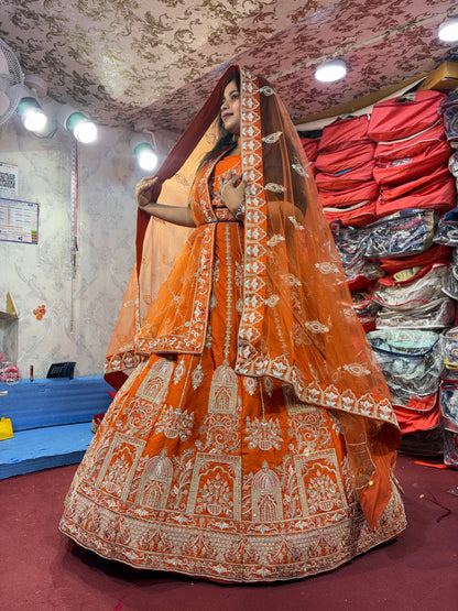 Lovely orange handwork peacock bridal Lehenga