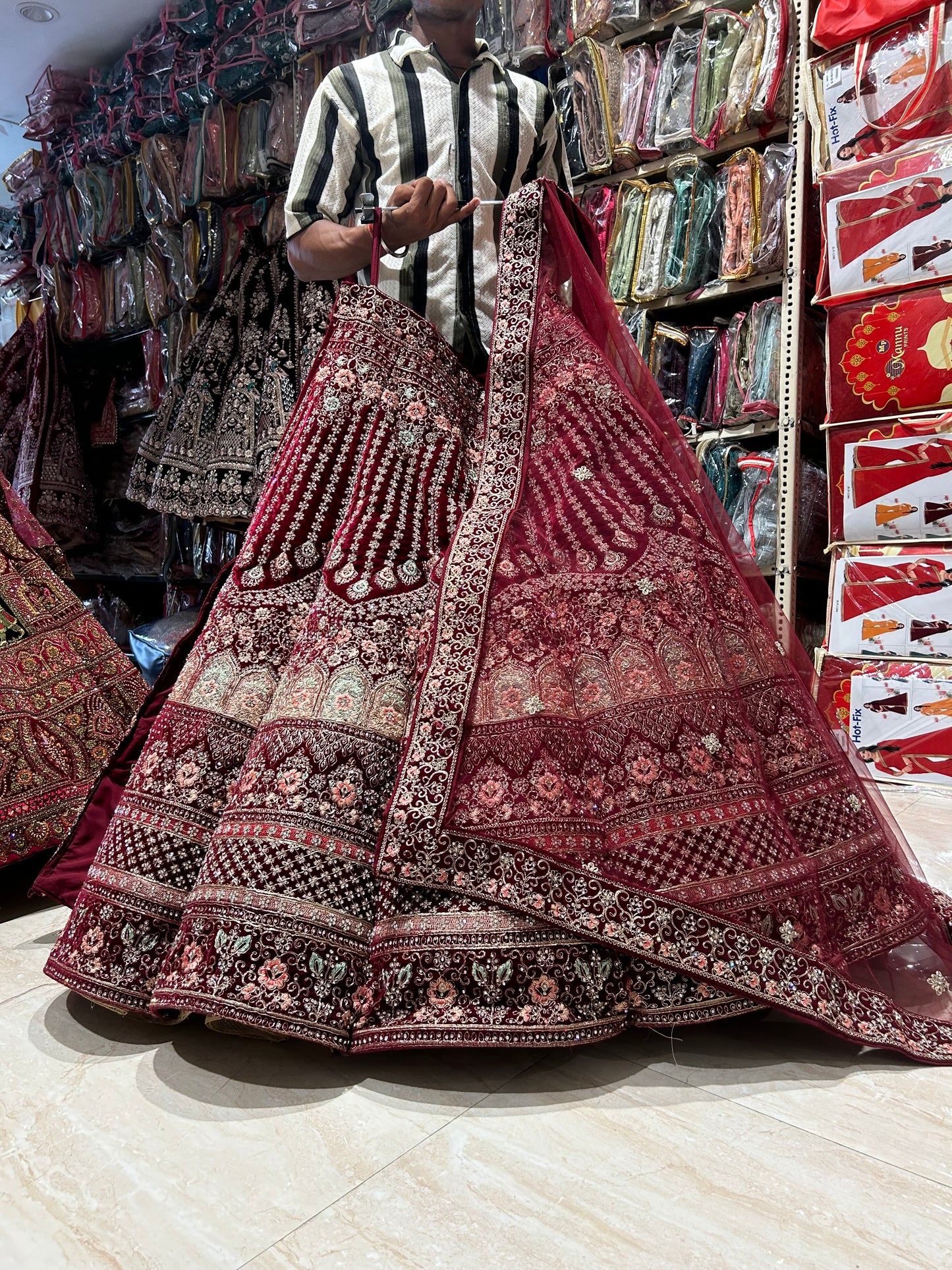 Famous red jhumka ball bridal Lehenga