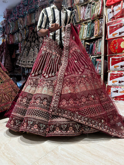 Famous red jhumka ball bridal Lehenga