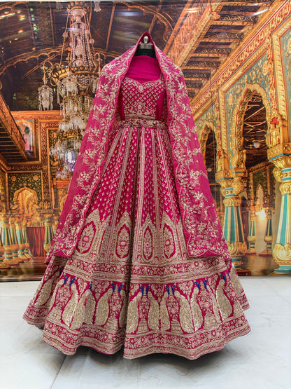 Eye catching rani pink peacock pure handwork heavy bridal Lehenga