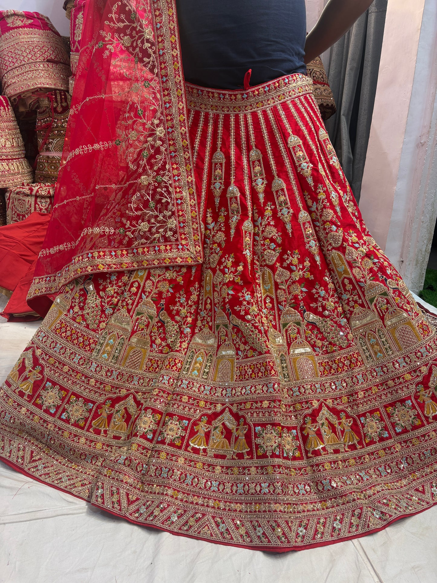 Tremendous red peacock bridal Lehenga