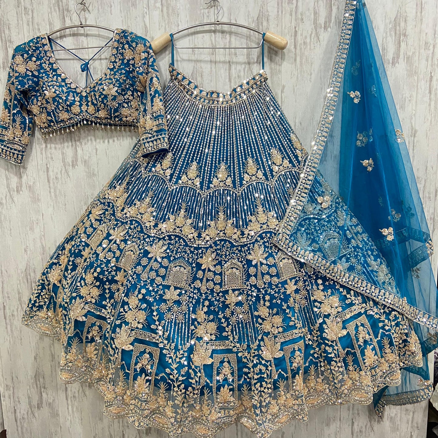 16 kali Heavy work Embellished green peacock crop top Lehenga