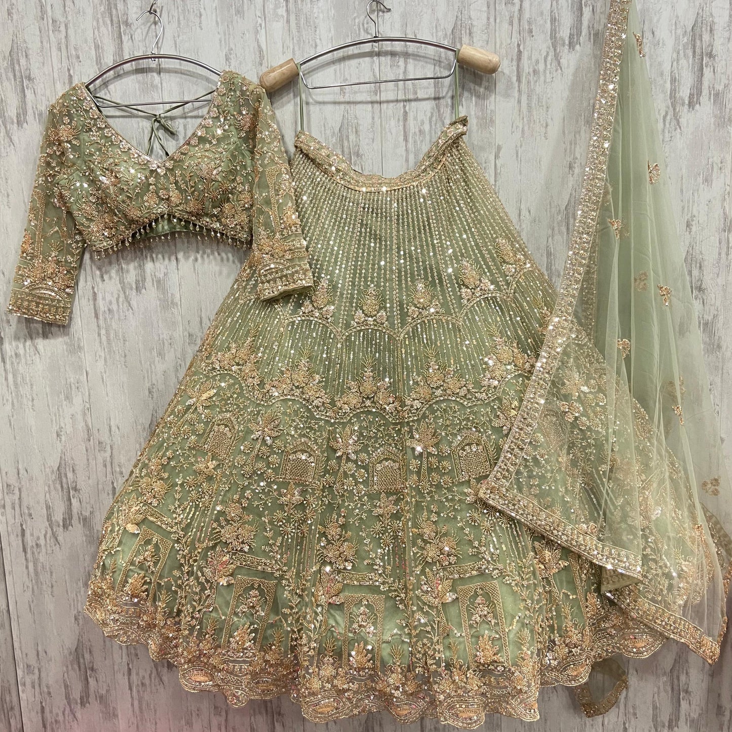 16 kali Heavy work Embellished green peacock crop top Lehenga