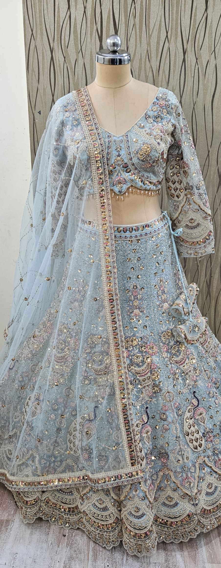 Eye catching light golden chiku brown peacock crop top Lehenga