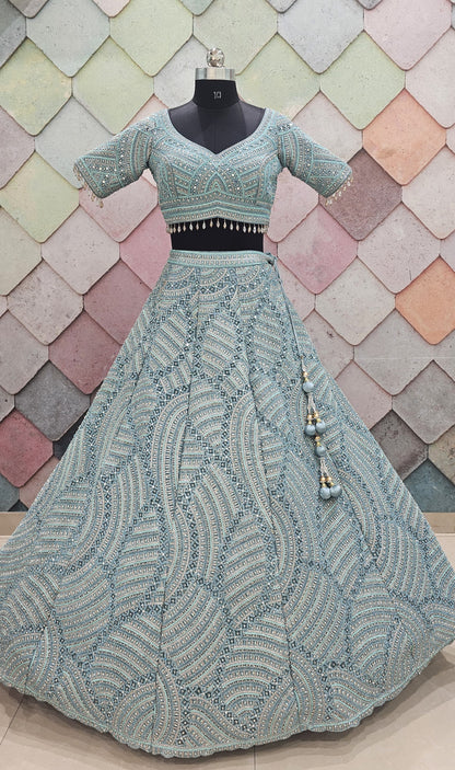 Encantador top corto de lehenga en red con jaal completo en azul cielo y verde mar.