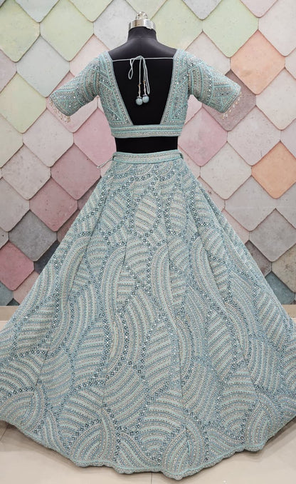 Encantador top corto de lehenga en red con jaal completo en azul cielo y verde mar.