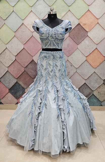 GAURAV GUPTA stunning designer outfit in a beautiful ice-blue shade, crafted with complete hand work on both front and back fish-cut  crop top lehenga