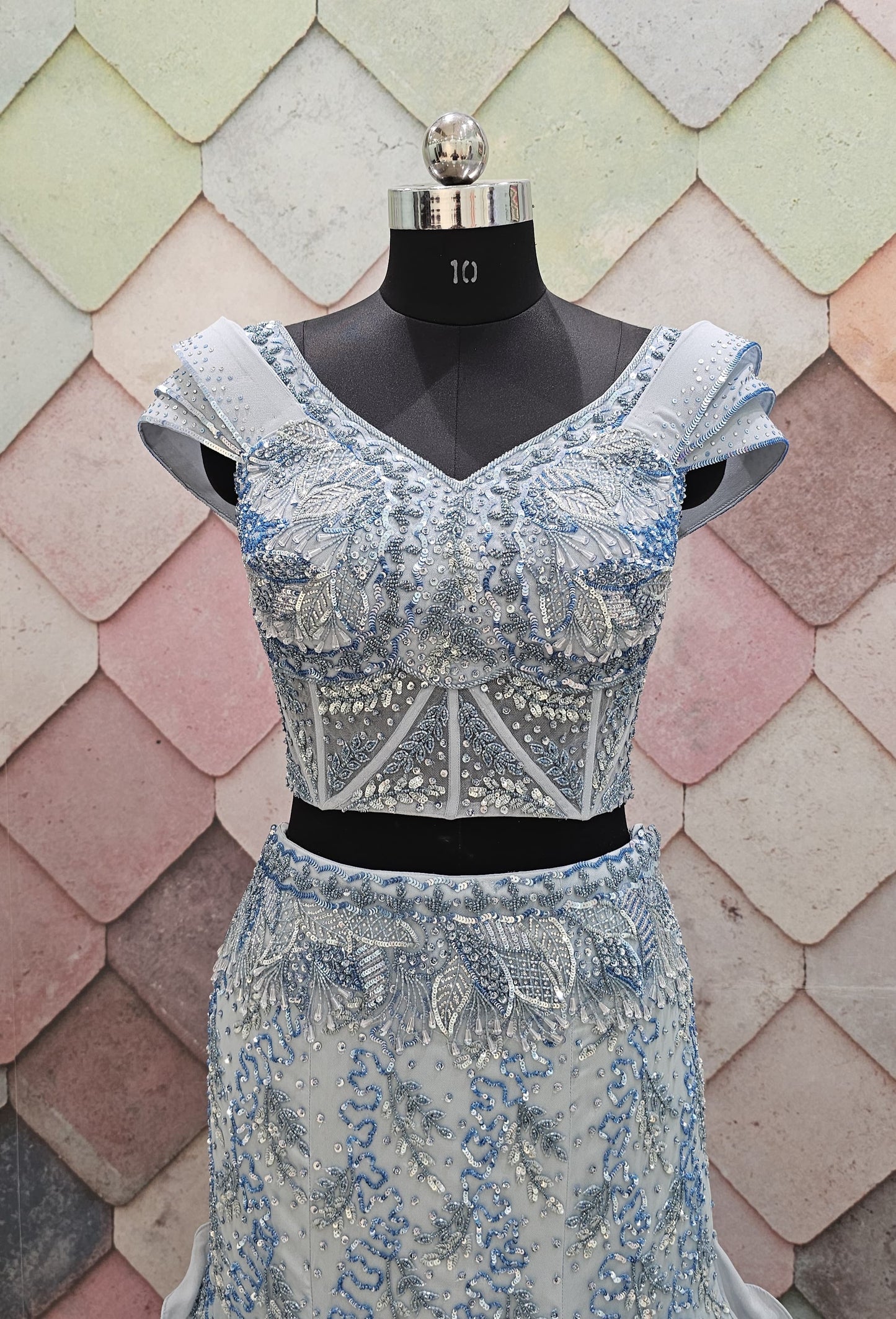 GAURAV GUPTA stunning designer outfit in a beautiful ice-blue shade, crafted with complete hand work on both front and back fish-cut  crop top lehenga