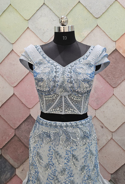 GAURAV GUPTA stunning designer outfit in a beautiful ice-blue shade, crafted with complete hand work on both front and back fish-cut  crop top lehenga