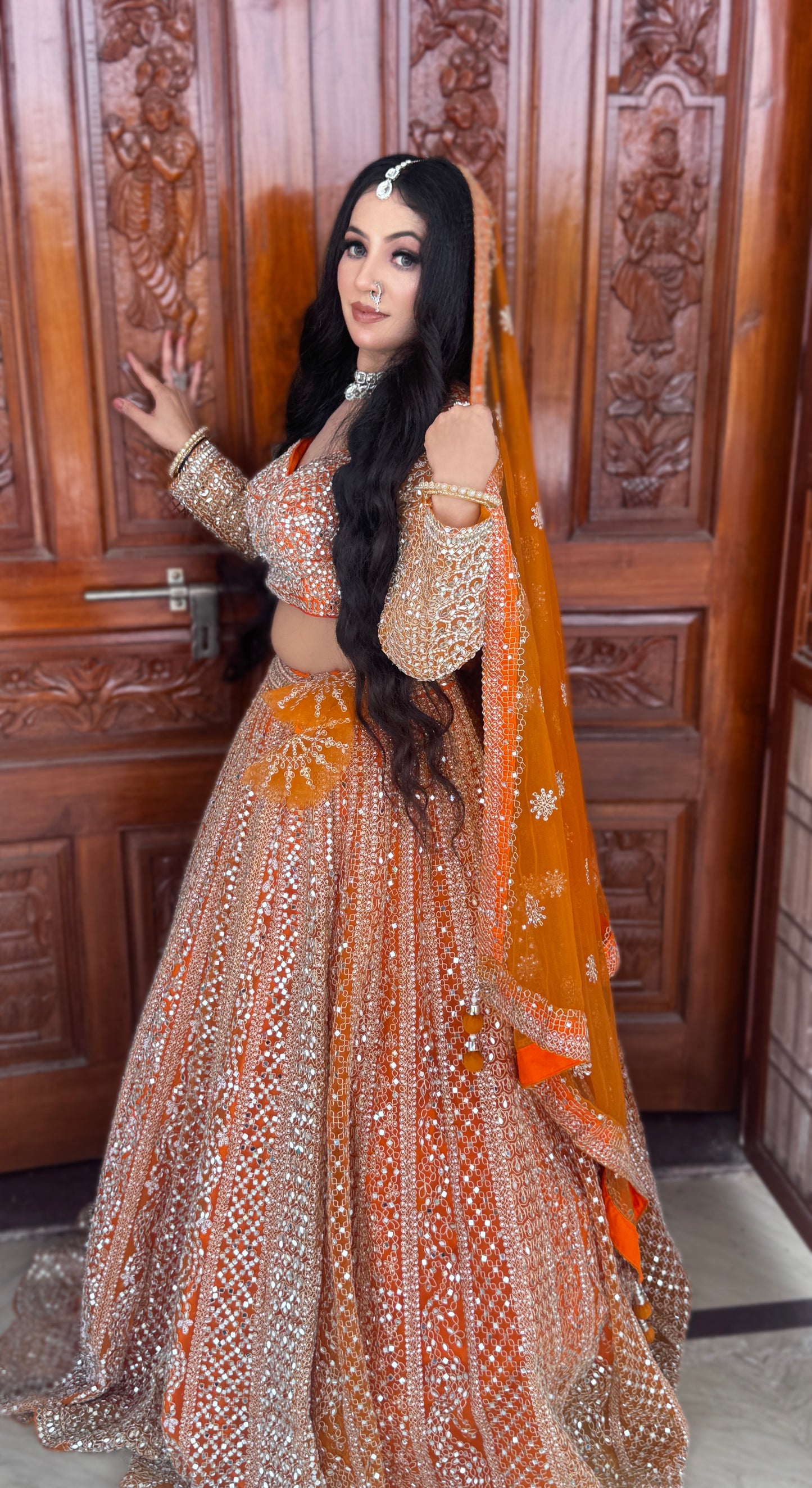 Good looking orange mirror work crop top Lehenga