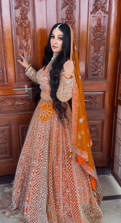Good looking orange mirror work crop top Lehenga