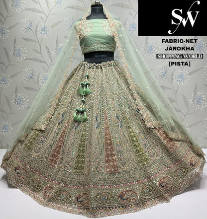 Designer pista green peacock net Lehenga