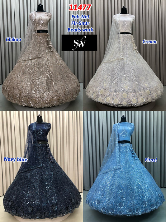 Chiku Golden White Navy Blue Firozi Blue Net Lehenga