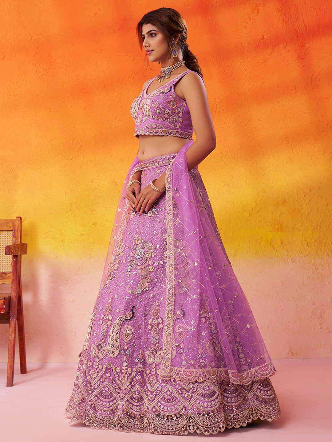 Tremendous Peacock Cream Net Fabric Sequins Lehenga 6246