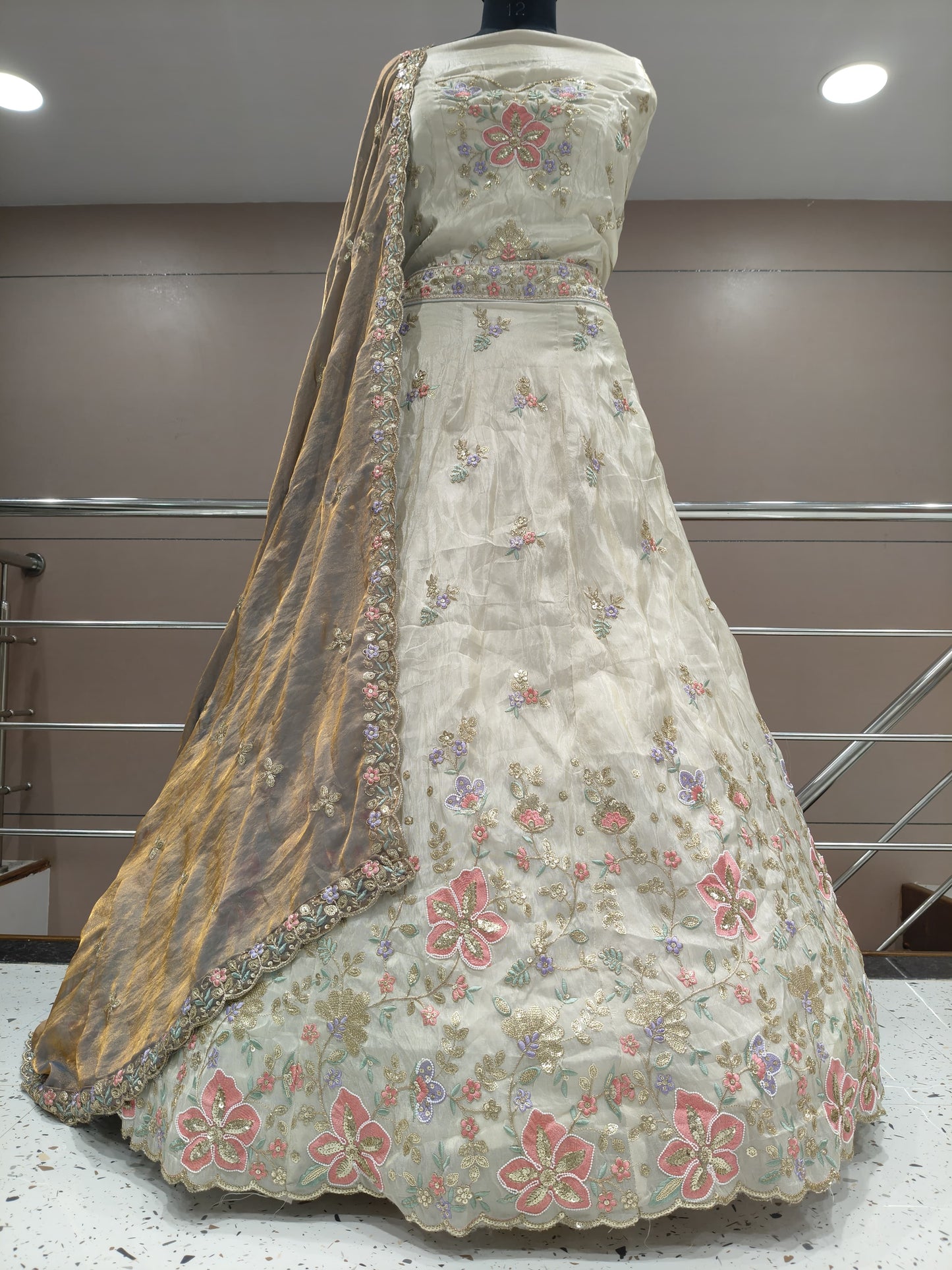 Pretty off white golden cream lehenga