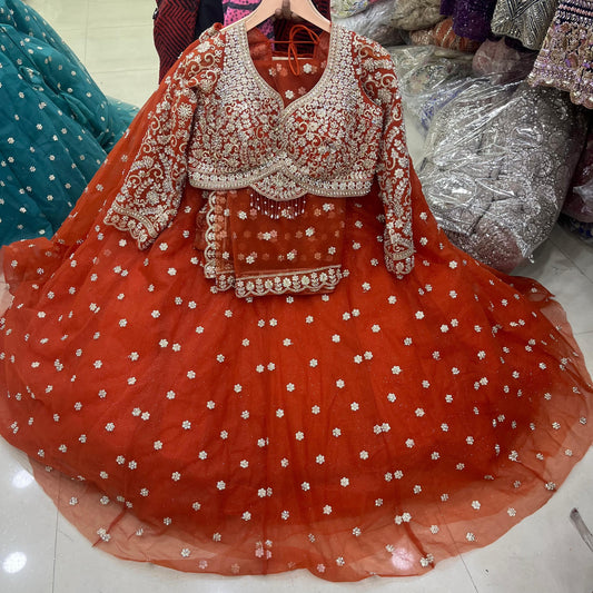 Engaging Rust Orange Booty Crop Top Lehenga